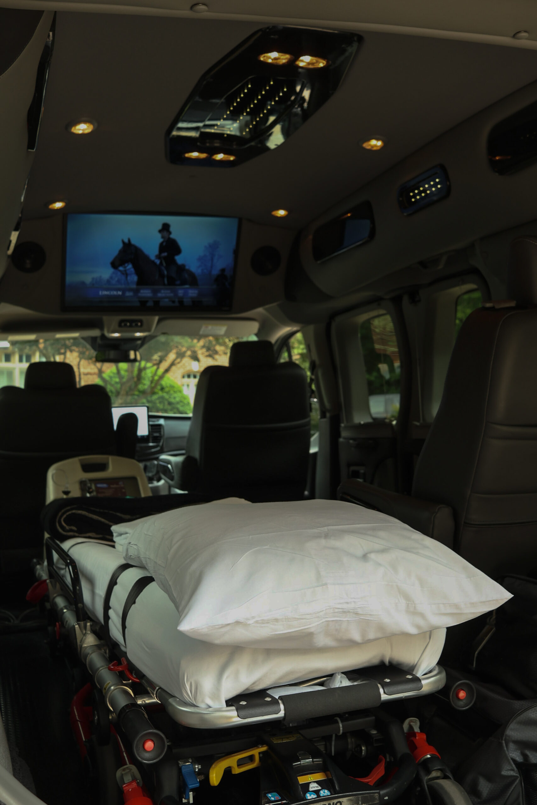 The image features a van equipped with a car seat and head restraint, highlighting the importance of safety in long-distance medical transport. Managed Medical Transport, Inc. prioritizes secure and comfortable travel for patients, ensuring their well-being during transport.