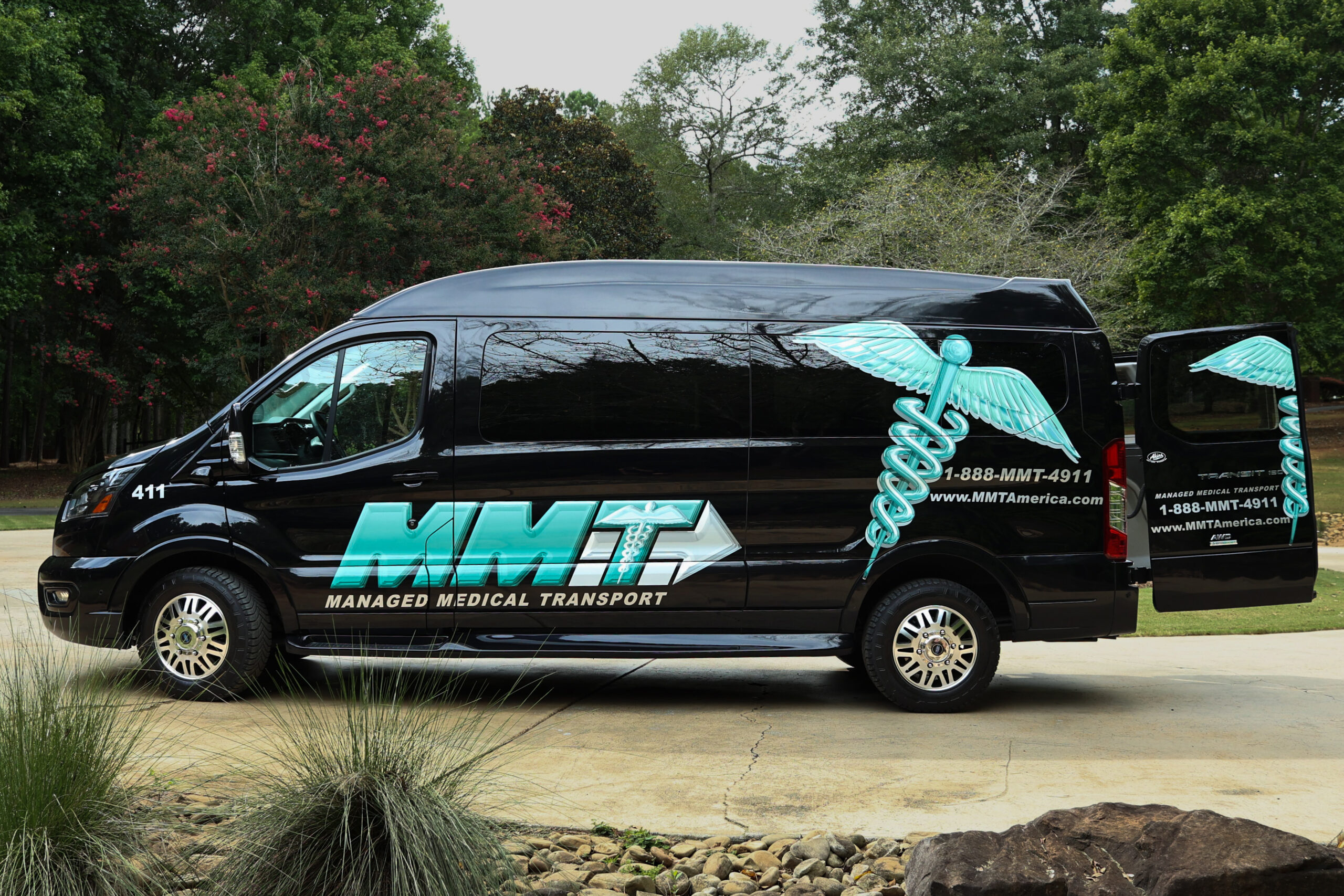 The image features a minivan, which is commonly used for long-distance medical transport services. This vehicle type is ideal for Managed Medical Transport, Inc. as it provides a reliable and spacious option for transporting patients safely and comfortably.