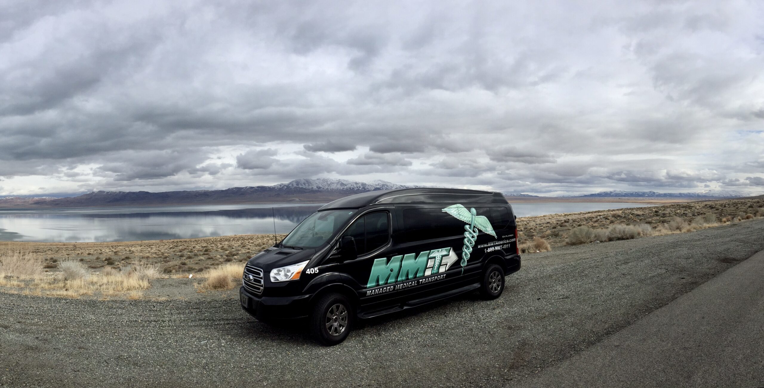 The image showcases a compact van, which is essential for Managed Medical Transport, Inc. as it highlights the type of vehicle used for long-distance medical transport services, ensuring safe and reliable mobility for patients.