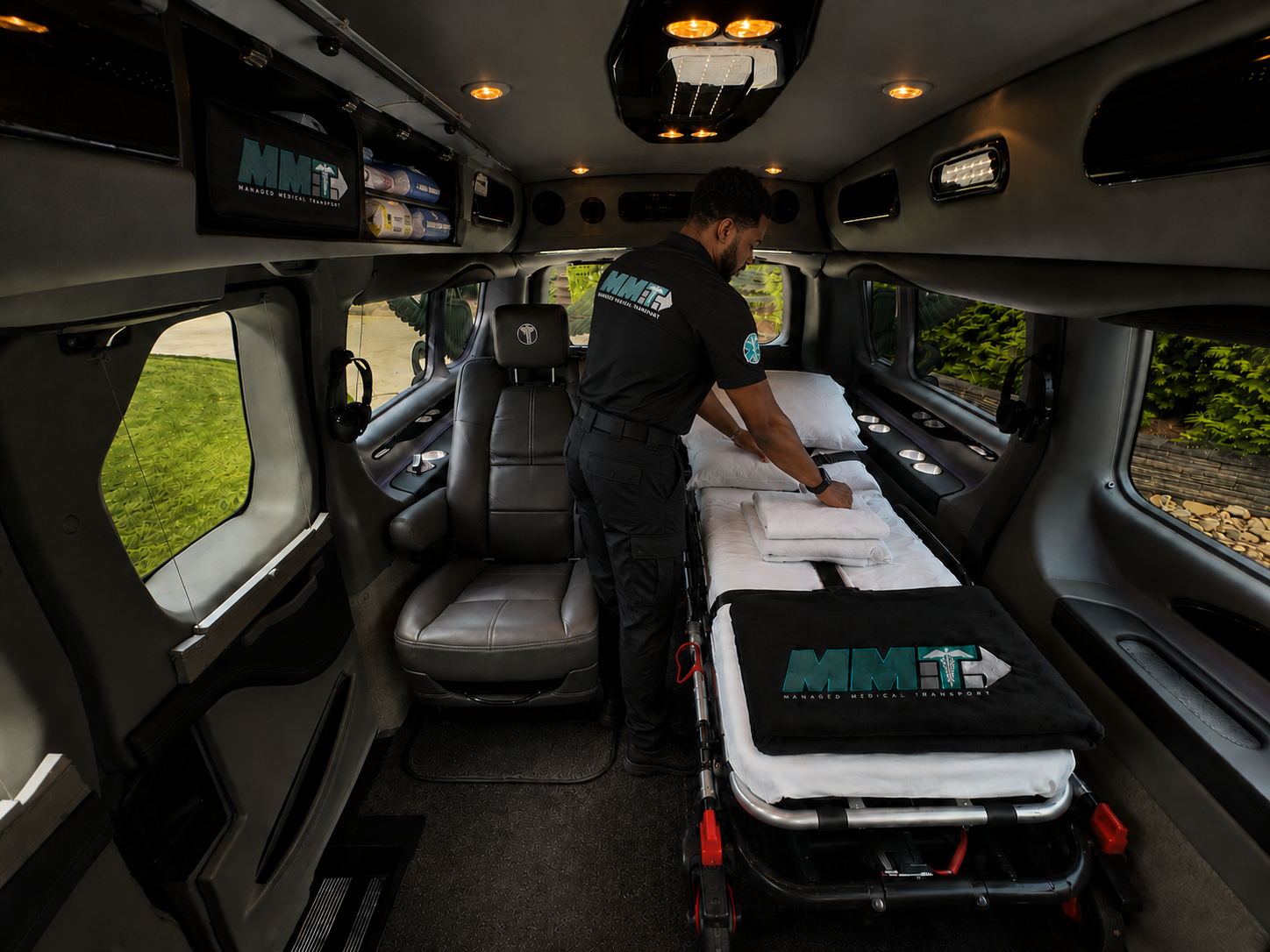 The image showcases an ambulance, a crucial mode of transport for long-distance medical emergencies. Managed Medical Transport, Inc. specializes in providing safe and efficient transportation for patients, ensuring timely access to healthcare services.